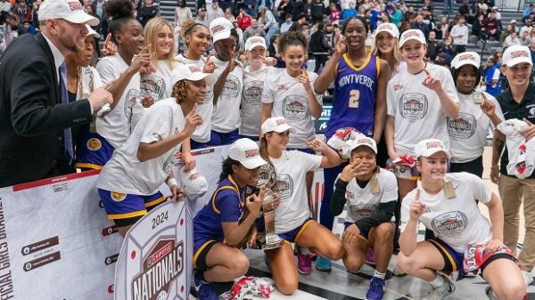 No. 9 Montverde Academy players and coaches celebrate their Chipotle Nationals title on Saturday. The Eagles, who beat No. 5 IMG Academy 61-53, have won three straight event titles dating back to when it was the GEICO Nationals. (Photo: Julie Brown)